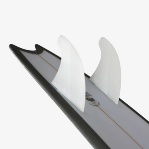 Hiatus Store FCS II Mick Fanning Twin +1 white surfboard fins with hatchet-tip design installed on a surfboard tail