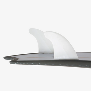 Hiatus Store FCS II Mick Fanning white twin plus 1 surfboard fins with hatchet-tip template on a surfboard tail